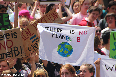 Children hold signs at a climate strike